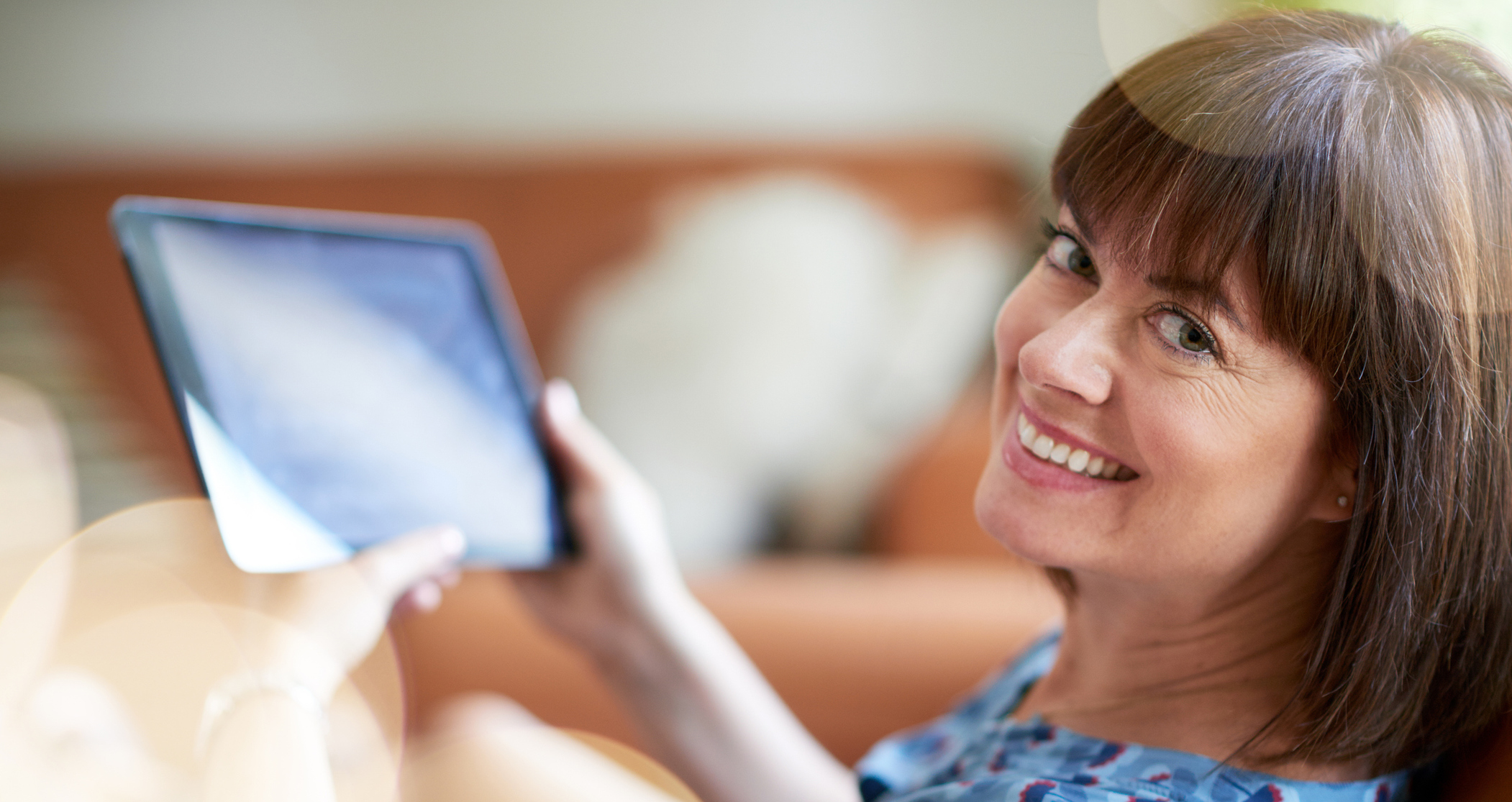 Happy women with a digital tablet in her hand