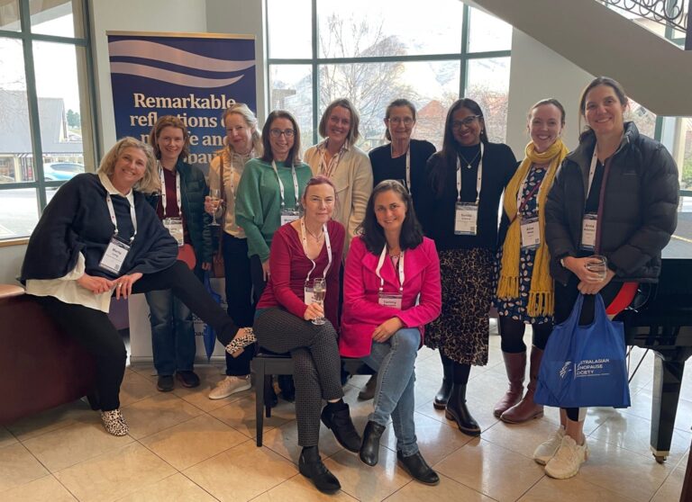 Group of women wearing conference lanyards posing together at the 2023 AMS Menopause Congress, highlighting event participation and professional collaboration.