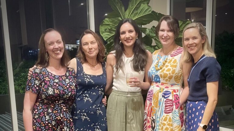 Group of women smiling together at the 2022 Menopause Congress, representing WellFemme’s team attending the professional event.