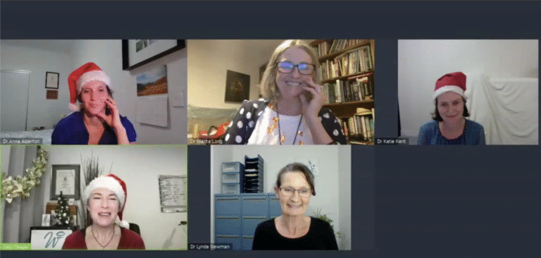 Screenshot of a virtual webinar with five women wearing festive hats, representing WellFemme’s 2021 Christmas Gift Q&A session.