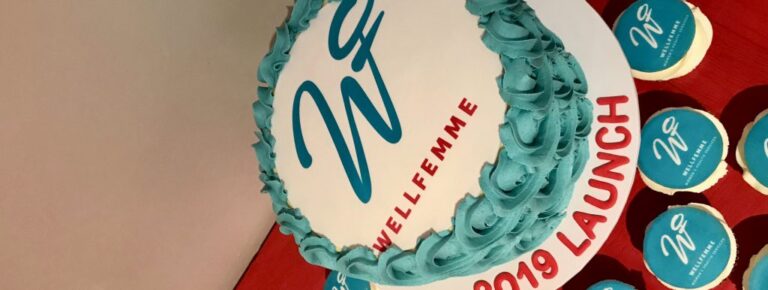 Celebration cake with “WellFemme” and “2019 Launch” icing, marking the launch of WellFemme’s telehealth menopause service